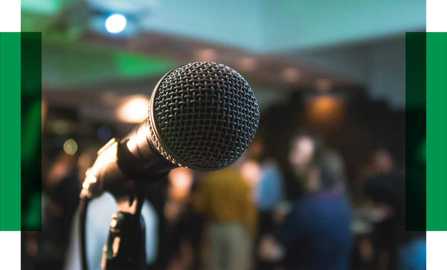 End of the year networking event 2024 Microphone in front of a crowd