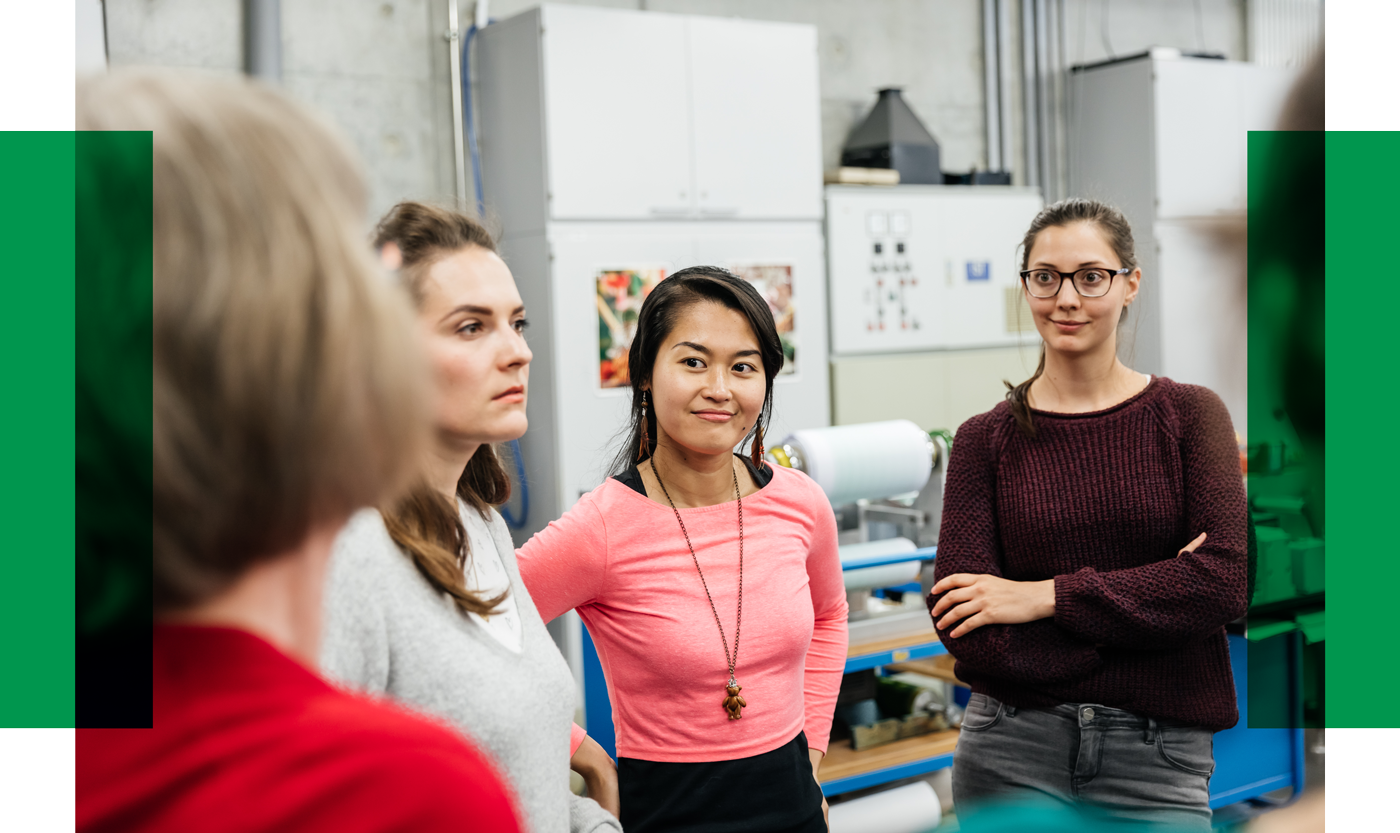 Female students are listening to a female role model.